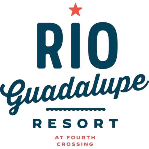 Logo for Rio Guadalupe RV Park & Resort; “RIO” in large blue letters with a red star above, “Guadalupe” in script below, “RESORT” in blue block letters, and “AT FOURTH CROSSING” in smaller red letters at the bottom.